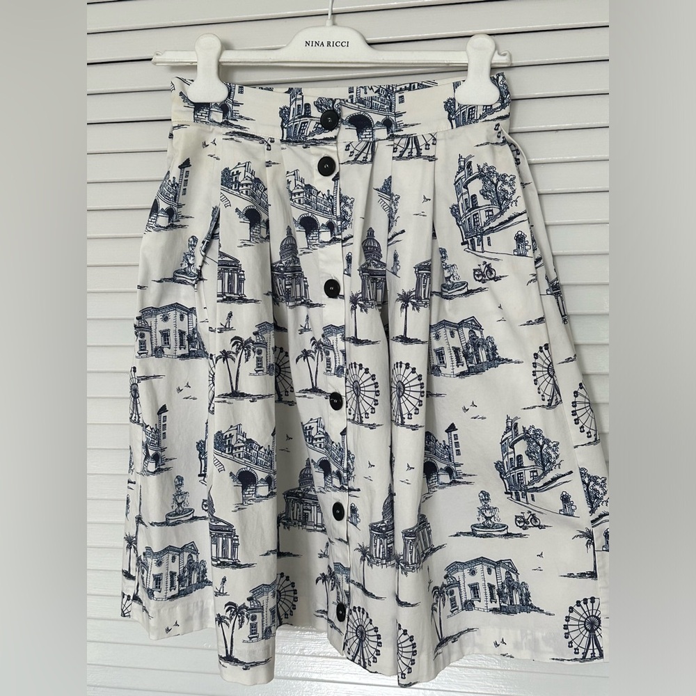 Maje midi skirt with blue toile print and front buttons. Size 38